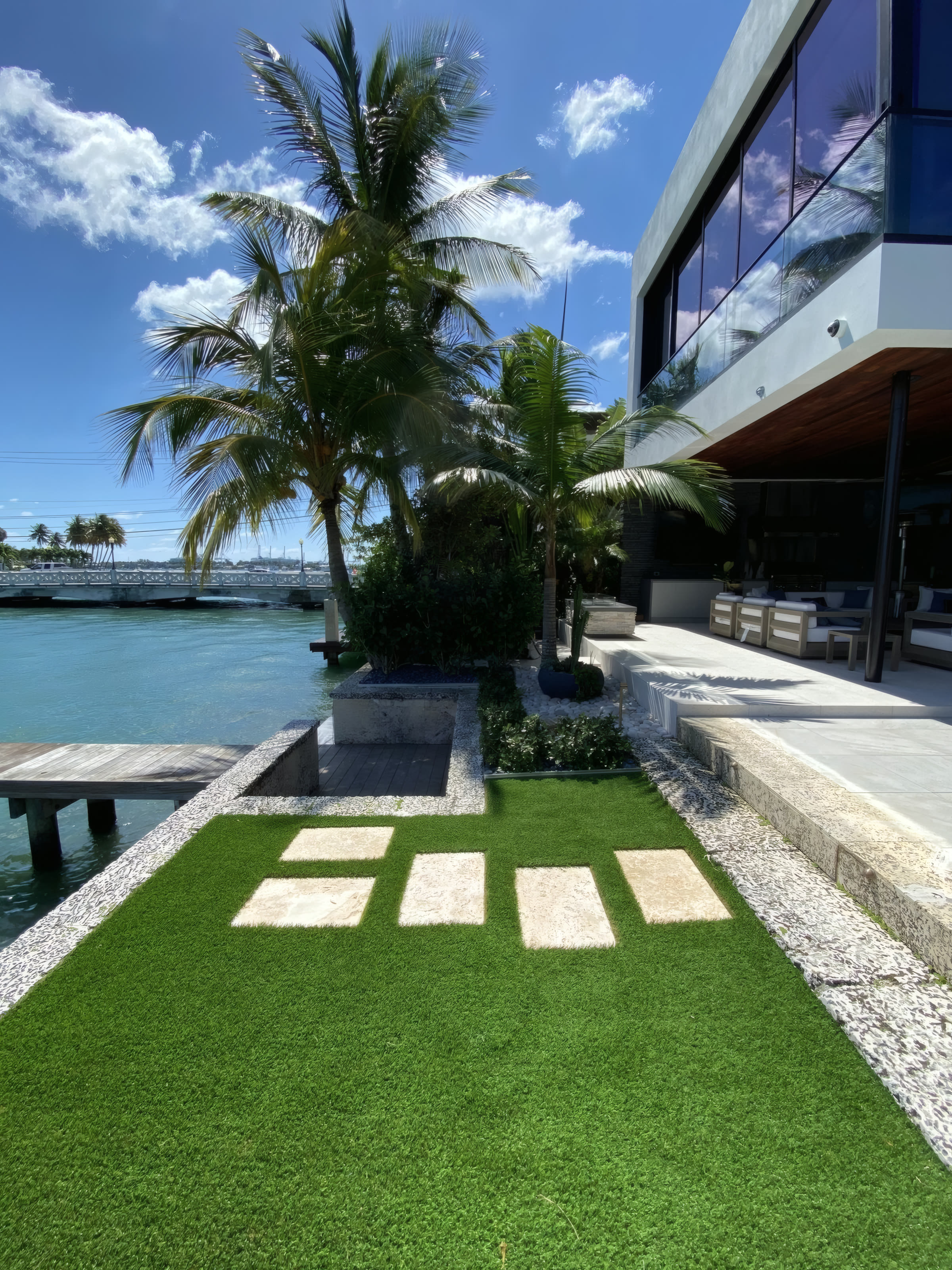 Paver-and-grass walkway by the water